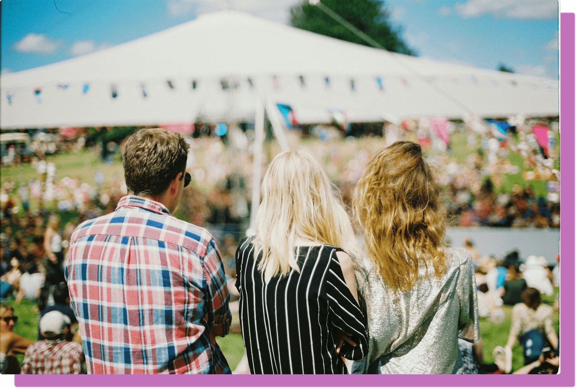 Three people at a music festival.