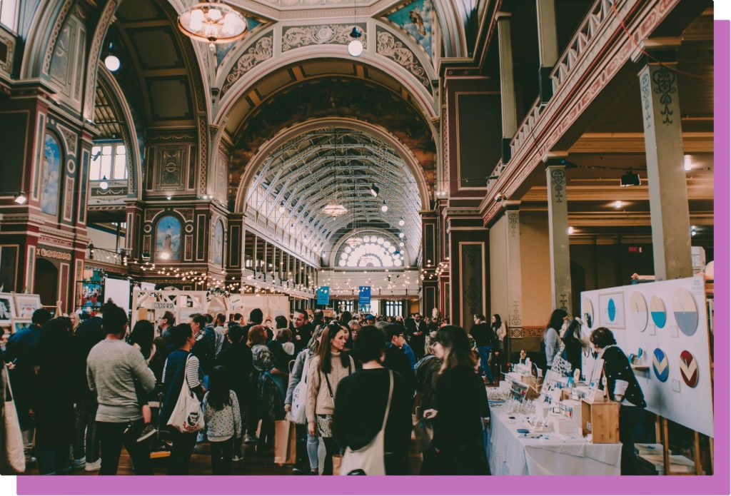 Networking event inside beautiful hall.