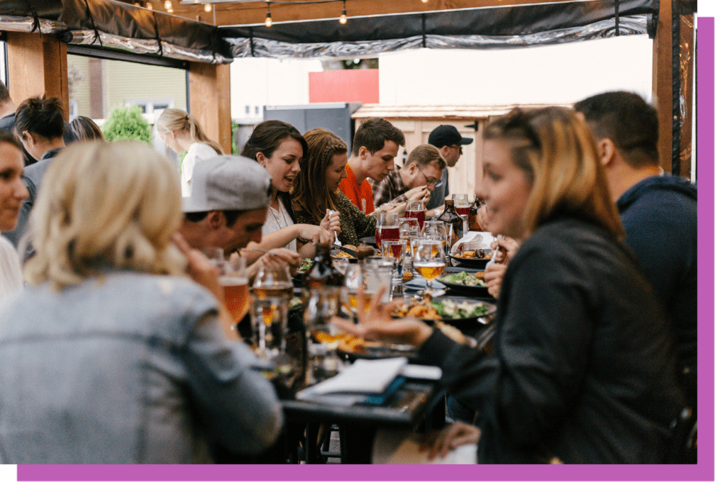 group of people networking around food and drinks