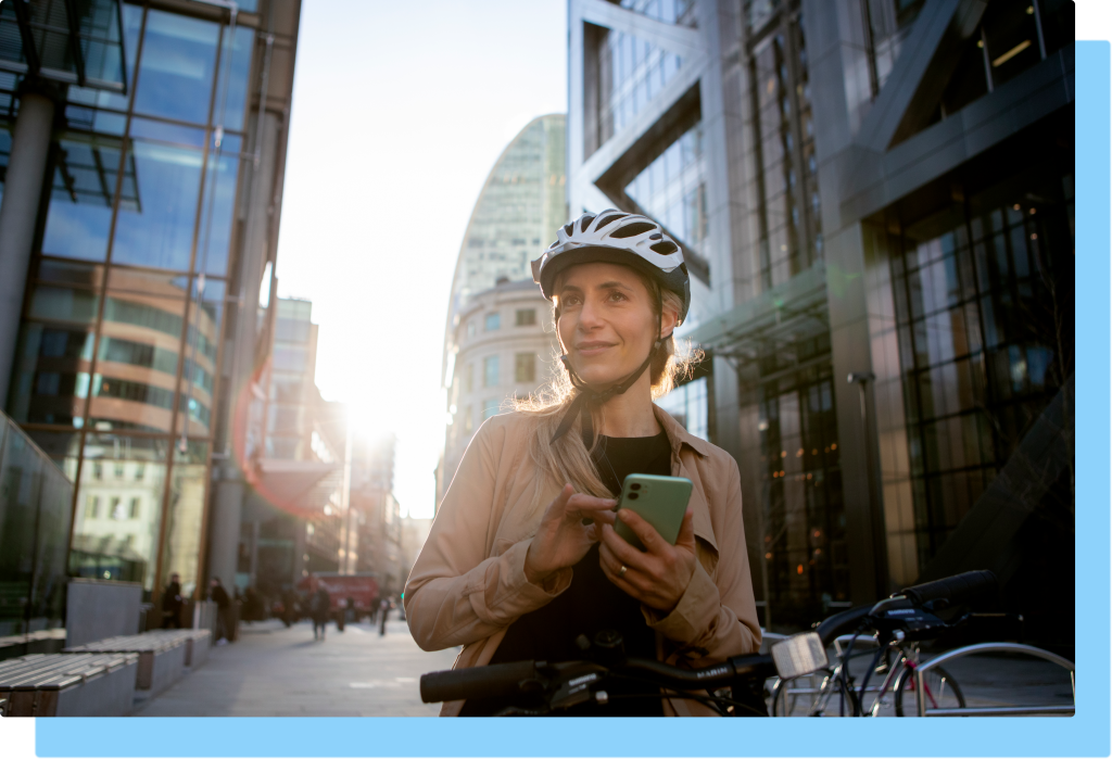 women checking her phone while navigating a new city