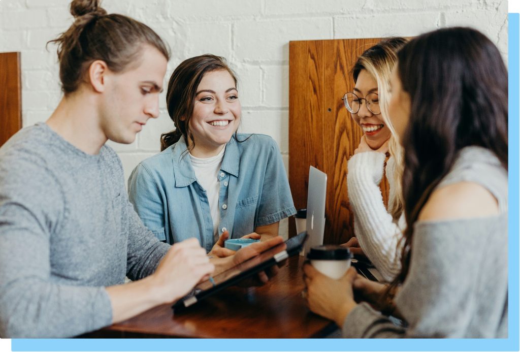 Group of people networking over coffee.