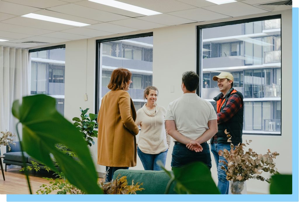 Group of people networking at event.